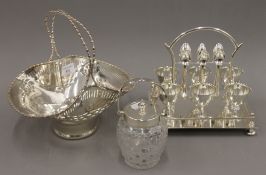 A silver plated egg cruet, a basket and a plate mounted preserve jar.