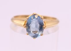 An 18 ct gold aquamarine ring. Ring size L.