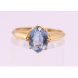 An 18 ct gold aquamarine ring. Ring size L.