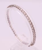 A 9 ct white gold and diamond bracelet. Total diamond weight approximately 2.1 carats. 18.5 cm long.