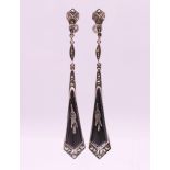A pair of silver Art Deco black enamel and marcasite screw-on drop earrings. 8.25 cm long.