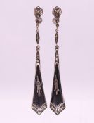 A pair of silver Art Deco black enamel and marcasite screw-on drop earrings. 8.25 cm long.