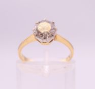 An 18 ct gold and platinum set diamond solitaire ring. Diamond weight approximately .75 carat.