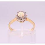 An 18 ct gold and platinum set diamond solitaire ring. Diamond weight approximately .75 carat.