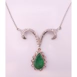 An 18 ct gold, diamond and emerald pendant necklace. Emerald pendant drop 2.