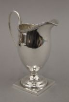 A silver cream jug. 12.5 cm high. 98 grammes.