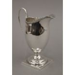 A silver cream jug. 12.5 cm high. 98 grammes.