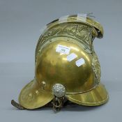A vintage brass fireman's helmet.