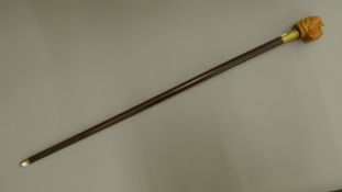 A walking stick with a wooden dog form handle. 92.5 cm long.