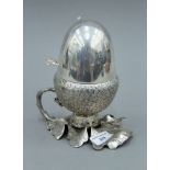 A silver plated acorn form egg coddler. 18.5 cm high.