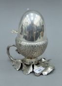 A silver plated acorn form egg coddler. 18.5 cm high.