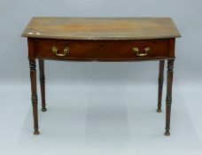 A Victorian mahogany bow front single drawer side table. 106 cm wide.