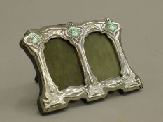 An Art Nouveau style silver double photograph frame. 11 cm wide.