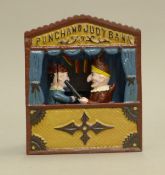 A cast iron Punch and Judy moneybox. 18 cm high.