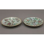 A pair of small 19th century Chinese famille rose plates, painted with birds,