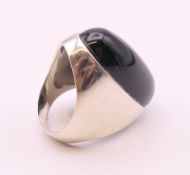 A silver dress ring. Ring size P.