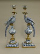 A pair of blue porcelain bird form candlesticks. 48 cm high.