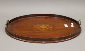 An Edwardian inlaid mahogany tray. 55 cm long.