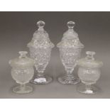 Two pairs of 19th century cut glass lidded sweetmeat jars. The largest pair 26 cm high.
