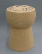 A champagne cork formed stool. 48 cm high.