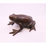 A bronze model of a frog. 4 cm long.