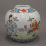 A 19th century Chinese porcelain ginger jar painted with a scholar and child,