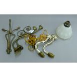 A pair of scrolled brass wall lights and one glass shade from Willingham Tabernacle,