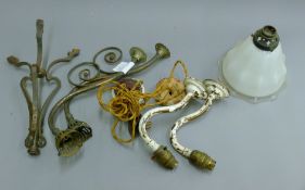 A pair of scrolled brass wall lights and one glass shade from Willingham Tabernacle,