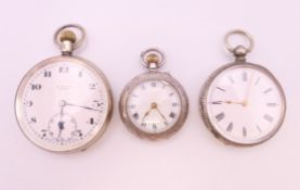 Three antique silver pocket watches. The largest 4.5 cm diameter.