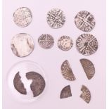 A collection of silver medieval coins. Largest approximately 2 cm diameter.
