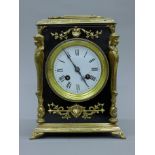 A 19th century brass mounted ebonised mantle clock. 25.5 cm high.