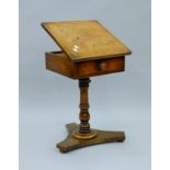 A Victorian mahogany pedestal reading table. 41 cm wide.