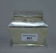 A silver tea caddy. 9 cm wide. 212.8 grammes.
