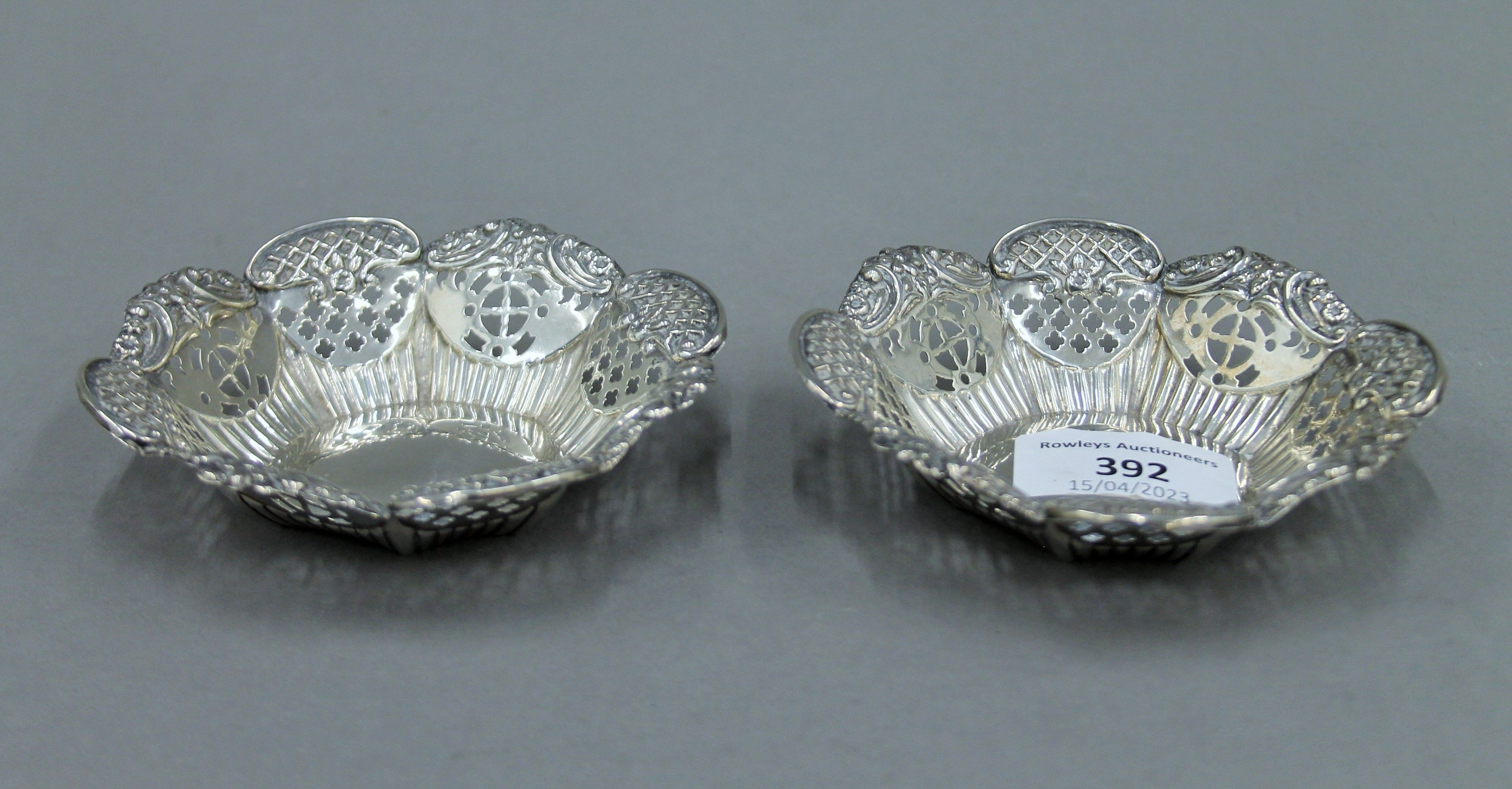 A pair of silver bon bon dishes, hallmarked for Birmingham 1899 and a pair of bottle coasters. - Image 2 of 5