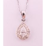 An 18 ct white gold diamond pear shaped pendant necklace. Total diamond weight approximately 0.