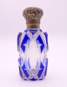 A silver topped blue and clear glass scent bottle. 7 cm high.