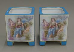 A pair of Sevres style porcelain cache pots.