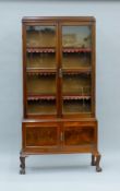An early 20th century glazed mahogany cabinet. 83 cm wide x 175 cm high.