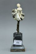 An Art Deco bronze and ivory figurine mounted on a marble plinth. 21.5 cm high.