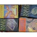 A quantity of books, including Harry Potter.