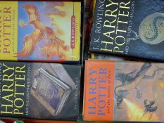 A quantity of books, including Harry Potter.