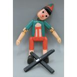 A large wooden Pinocchio puppet. Approximately 90 cm high.