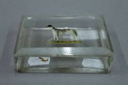 A glass trinket box, the lid decorated with a greyhound. 11 cm wide.