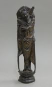 An Oriental silver inlay wooden figure. 29 cm high.