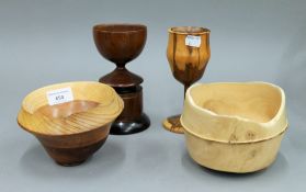 Two treen cups and two treen bowls. The largest 16.5 cm high.