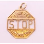 A 9 ct gold ' I'LL NEVER STOP LOVING YOU' charm. 2 cm wide. 2.5 grammes.