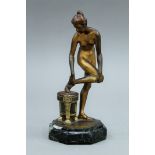 An Art Deco bronze model of a nude girl mounted on a marble plinth base. 15 cm high.