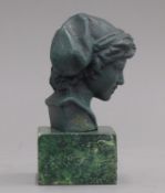 A small bronze bust of a boy on a plinth base. 13 cm high.