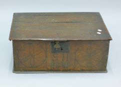 A 17th century oak Bible box. 63 cm wide.