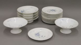 A florally painted porcelain dessert set.